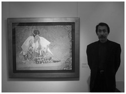 写真:代表作の横に立つ江田さん